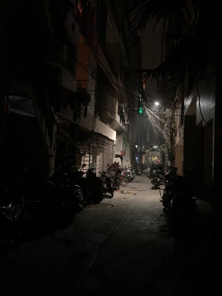 A New Delhi alley at night.